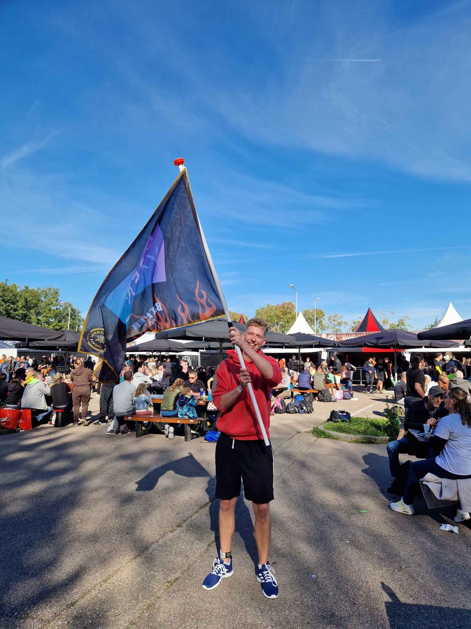 Mauro at an obstacle run with OpenValue flag